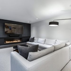 interior limestone fireplace with modern grey plaster walls